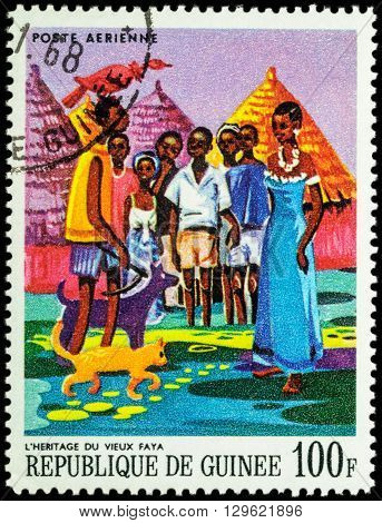 MOSCOW RUSSIA - MAY 12 2016: A stamp printed in Guinea shows image of African Legends - Heritage of the old Faya series "Paintings of African Legends" circa 1968