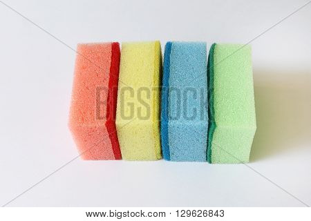Colorful scouring and sponge on white isolated background