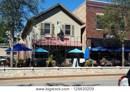 PLAINFIELD, ILLINOIS / UNITED STATES - SEPTEMBER 20, 2015: One may drink fine wine and enjoy artisan cheese at the Wine and Cheese by TCC Restaurant and Wine Bar in downtown Plainfield.