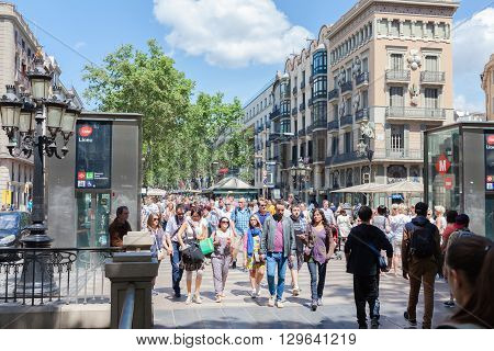 BARCELONA SPAIN-MAY 13 2016: Barcelona is the capital of the autonomous community of Catalonia in Spain city. Crowd of people visit the Rambla de Barcelona Spain.