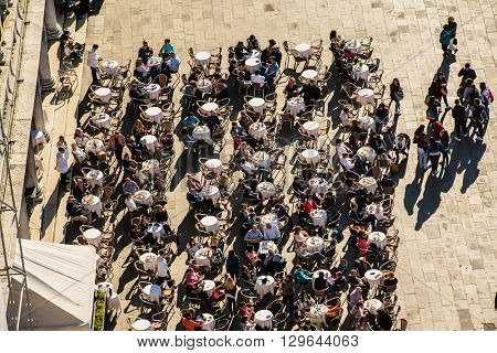 VENICE, ITALY - APR 19, 2016: people in the cafe around the Markus Place, the central place in Venice. Italy. 