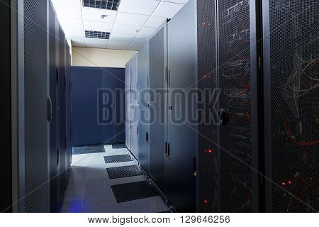 room with ommunication equipment and mainframe in data center rows