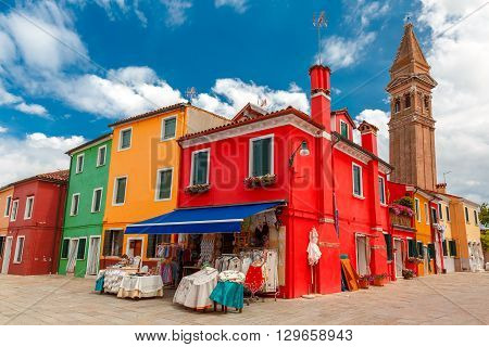 Colorful houses and church on the famous island Burano, Venice, Italy