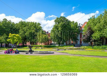 Dublin Ireland - July 30 2013: People in he St Patrik's gardens