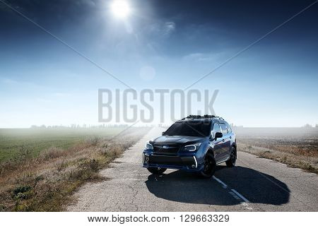 Saratov, Russia - October 21, 2015: Blue car Subaru Forester standing on asphalt road at countryside at daytime