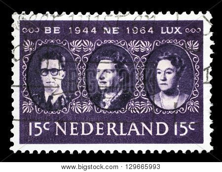 ZAGREB, CROATIA - JUNE 24: a stamp printed in the Netherlands shows King Baudouin, Queen Juliana and Grand Duchess Charlotte, Benelux, circa 1964, on June 24, 2014, Zagreb, Croatia