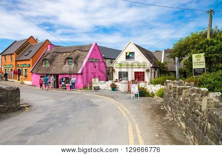 Calway Ireland - August 4 2013: Tourists between the colored houses of the Doolin village