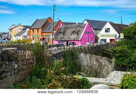 Calway Ireland - August 4 2013: Tourists between the colored houses of the Doolin village
