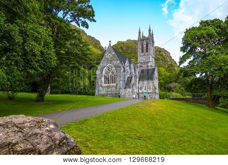 Calway Ireland - August 4 2013: Connemara area visitors in front of the Gothic church of the Kylemore abbey