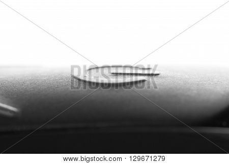 Close-up of a black button on the electronic device