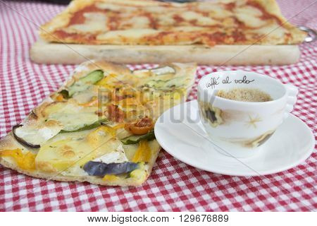 handcraft vegetarian pizza with near a cup of coffee espresso