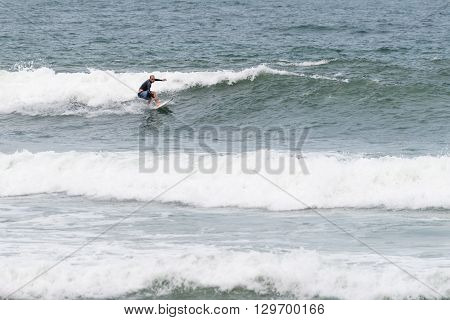 Surfers In Action At The Brava Beach In Florianopolis,