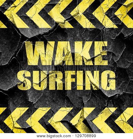wake surfing sign background, black and yellow rough hazard stri
