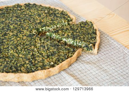 Homemade shortcrust pastry quiche with tofu and spinach