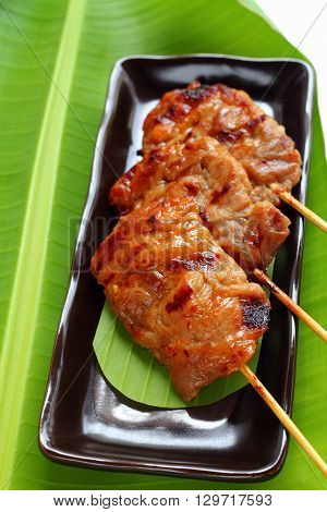 Roasted pork on banana leaf Thai food style.
