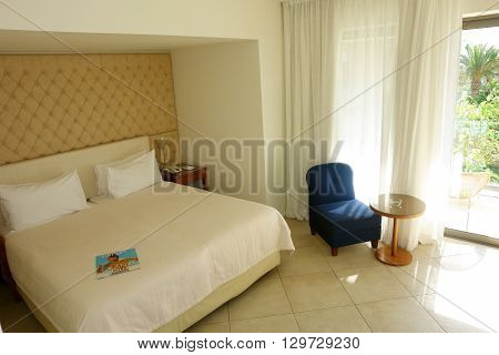 HERAKLION CRETE GREECE - MAY 13 2014: The Interior room in modern building of villa with balconies on the terrain of luxury class hotel on the Mediterranean coast of Crete, May 13, 2014, Greece.