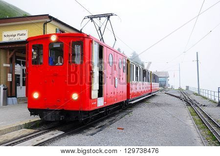 Schynige Platte Switzerland - July 08 2012: Retro passenger train is ready to depart to Interlaken.