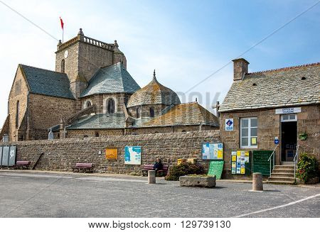 Barfleur France - May 21 2012: Normandy the tourist office of the village with the church domes in the background.