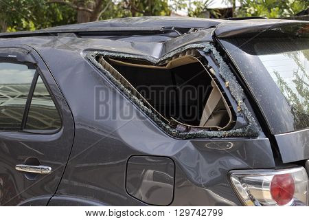 A wrecked car lays in wait after a vicious car accident. 