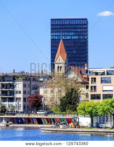 Zug, Switzerland - 6 May, 2016: view on the city of Zug from Lake Zug. The city of Zug is the capital of the Swiss canton of Zug. Lake Zug (German: Zugersee) is a lake in central Switzerland situated between Lake Lucerne and Lake Zurich.