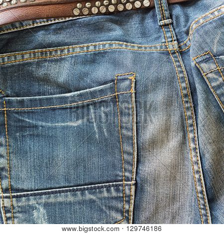 blue jeans with brown leather belt, clothing industry