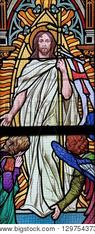 PRAGUE CZECH REPUBLIC - APRIL 5 2016: Stained Glass in the Basilica of Vysehrad in Prague Czech Republic depicting Jesus rising from the grave