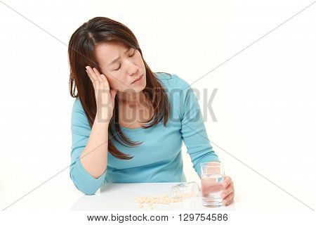 portrait of Japanese woman suffers from melancholy on white background
