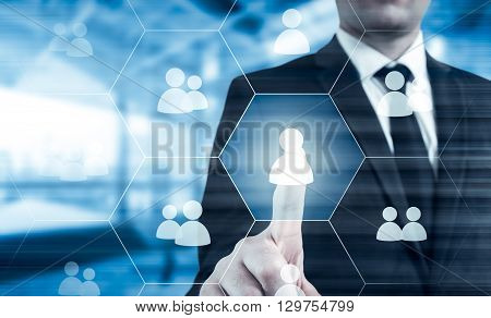 Hand carrying businessman icon network - HRHRMMLM teamwork and leadership concept.