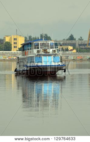 KIEV,UKRAINE - MAY 15, 2016: Pleasure boats on the Dnepr River and river shore in historical area. Kiev. Ukraine