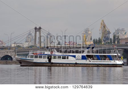 KIEV,UKRAINE - MAY 15, 2016: Pleasure boats on the Dnepr River and river shore in historical area. Kiev. Ukraine