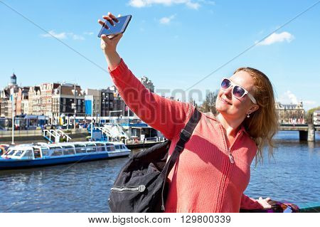 Young woman making a selfie in Amsterdam the Netherlands