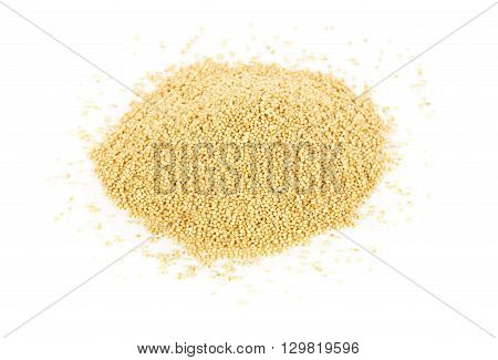 Heap of raw uncooked amaranth seeds over white background
