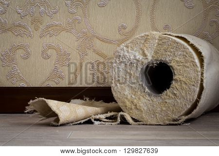 cut the tissue roll on the floor on the background Wallpaper