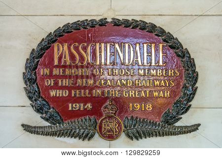 Dunedin New Zealand - November 16 2014: The Passchendaele memorial plate at Dunedin railway station New Zealand. The plate commemorates 56 members of the Dunedin section of New Zealand Railways (NZR) who lost their lives during the First World War.