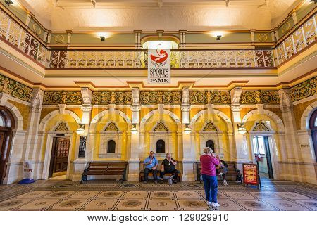 Dunedin New Zealand - November 16 2014: Inside the Dunedin Railway Station showing the booking hall's mosaic floor built 1906 in a revived Flemish renaissance style.