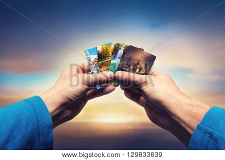 Male hands lolding seasons cards
