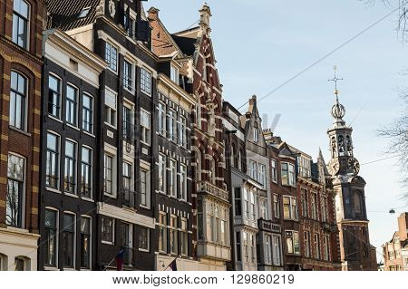 AMSTERDAM NETHERLANDS - 16TH FEBRUARY 2016: The outside of buildings in Amsterdam during the day in the Centrum area showing the style of the buildings.