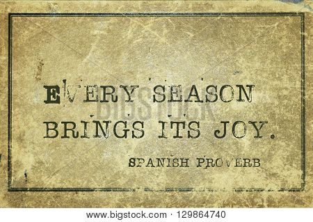 Every season brings its joy - ancient Spanish proverb printed on grunge vintage cardboard
