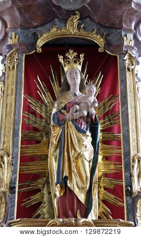 URSBERG, GERMANY - JUNE 09: Virgin Mary with baby Jesus, altar in the monastery church of St. John in Ursberg, Germany on June 09, 2015.