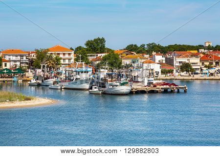 Keramoti, Greece - May 1, 2016: Keramoti port and town view with ferry boat going to Thassos island