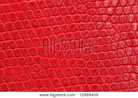 Trama di similpelle rosso closeup. Motivo ripetuto.