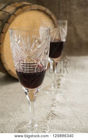 Old octave and two wineglasses are on sacking
