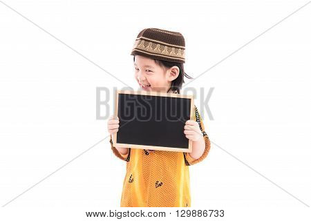 Close up of cute muslim boy on white background isolated.