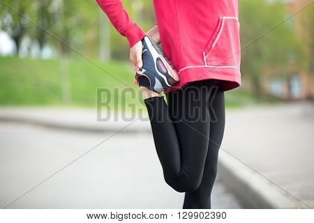 Jogger Doing Stretches Before Running Practice. Close-up