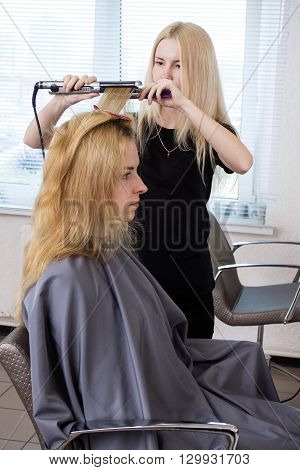 Barber Straightening Client's  Hair