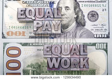 equal pay for equal work concept made from metallic letterpress type on US dollar banknotes