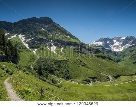 A view of Alpine mountains and the Koerbersee lake near the village Schroecken in Bregenzerwald region Vorarlberg Austria