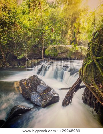 Vintage retro effect filtered hipster style image of tropical waterfall Phnom Kulen, Cambodia