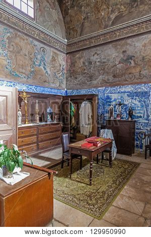 Santarem, Portugal. September 12, 2015: The Baroque sacristy with blue tiles and frescos painted in the walls and ceiling. Church of Santa Cruz. 13th century Gothic Architecture. Santarem, Portugal.