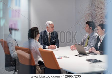 business people group brainstorming on meeting and businessman presenting ideas and projects oon laptop and tablet computer